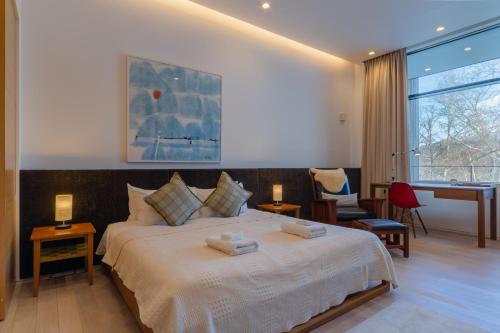 Ένα ή περισσότερα κρεβάτια σε δωμάτιο στο Yanagi House by H2 Life