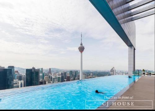 a swimming pool on the roof of a building with a view of a city at Platinum Sky Pool Must book KLCC KL Tower网红必订无边无际泳池 in Kuala Lumpur