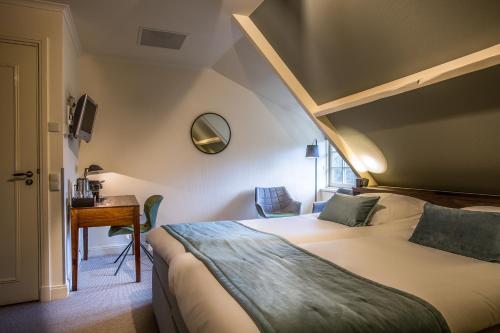 Een bed of bedden in een kamer bij Landgoed De Uitkijk Hellendoorn
