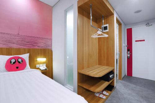 Ένα ή περισσότερα κρεβάτια σε δωμάτιο στο favehotel Ketapang