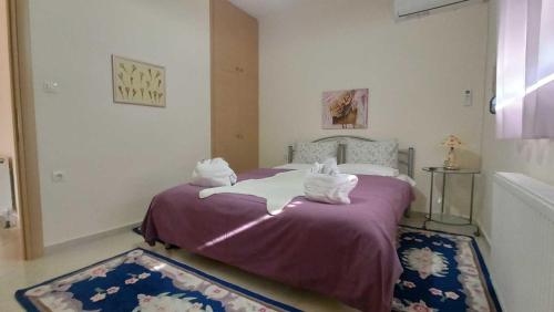 a bedroom with a bed with two pillows on it at Panorama Xanthis in Xanthi