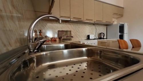 a kitchen with a sink and a faucet at Panorama Xanthis in Xanthi