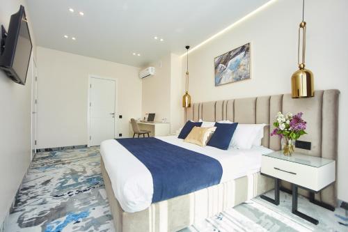 Ένα ή περισσότερα κρεβάτια σε δωμάτιο στο Jupiter Hotel