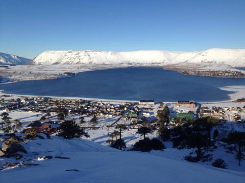 an aerial view of a town in the snow at Lodge Tikilen Caviahue in Caviahue
