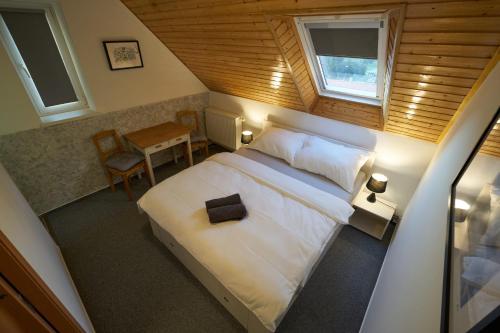 Postel nebo postele na pokoji v ubytování Vila U Parku