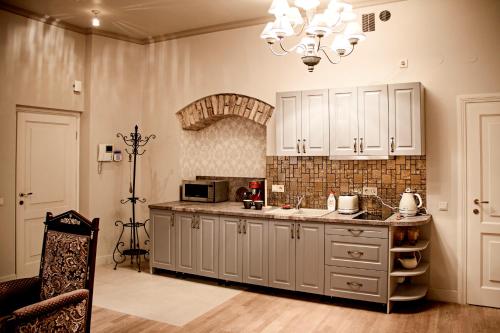Virtuvė arba virtuvėlė apgyvendinimo įstaigoje Gaono apartment