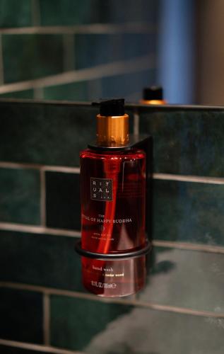 a bottle of red lipstick sitting on a counter at das flax allgäu in Dietmannsried