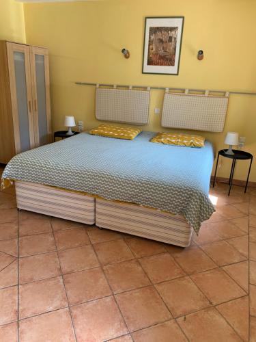 Postel nebo postele na pokoji v ubytování LA BASTIDE DU GINESTE - Olives