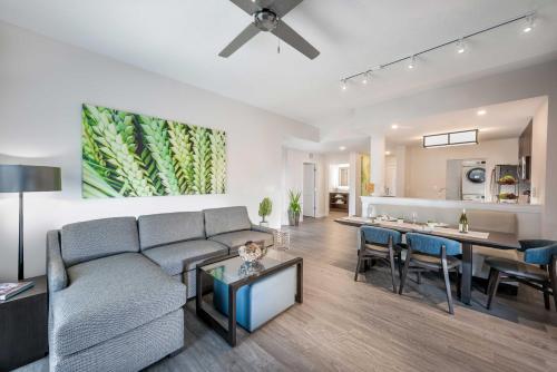 a living room with a couch and a dining room at The Grove Resort & Water Park Orlando in Orlando