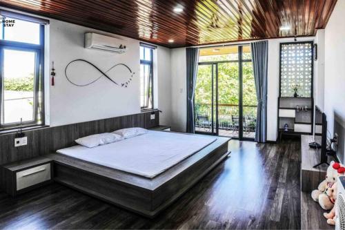 Ένα ή περισσότερα κρεβάτια σε δωμάτιο στο F.Home Modern & Art 3BR Near My Khe Beach