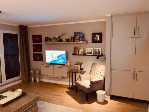 Televisyen dan/atau pusat hiburan di Penthouse-Suite am Plöner See