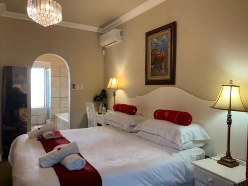 Ліжко або ліжка в номері Villa Lugano Guesthouse