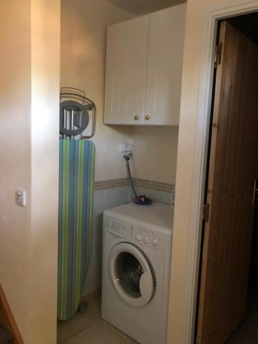 a washer and dryer in a room with at LA BASTIDE DU GINESTE - Poppys in Flayosc