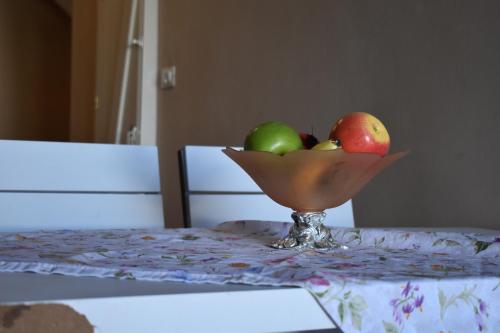 a bowl of fruit sitting on top of a table at Mantilaria in Fira