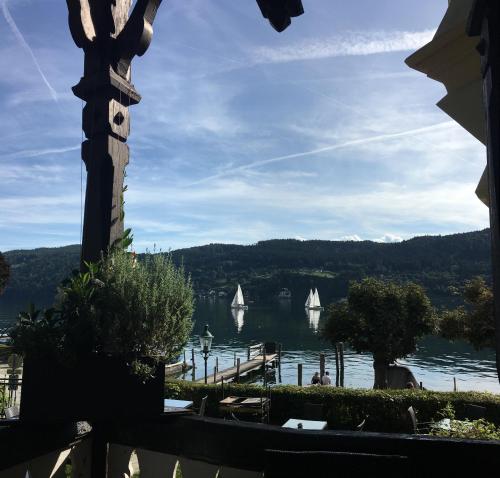 a view of a lake with sailboats in the water at Villa Streintz in Millstatt
