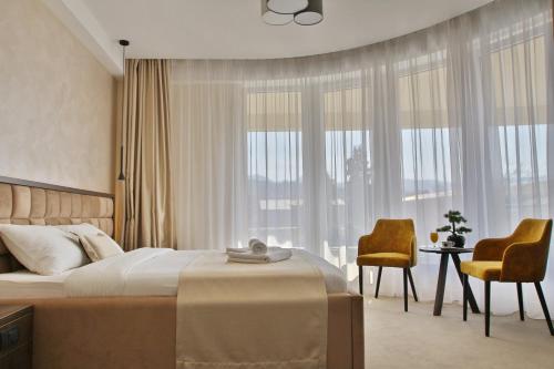 Ένα ή περισσότερα κρεβάτια σε δωμάτιο στο Royal Residence