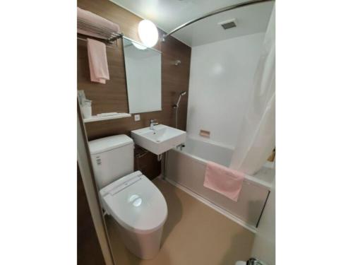 a bathroom with a white toilet and a sink at Hotel Ascent Hamamatsu / Vacation STAY 79775 in Hamamatsu