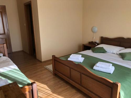 Ένα ή περισσότερα κρεβάτια σε δωμάτιο στο Bed and Breakfast Albatros