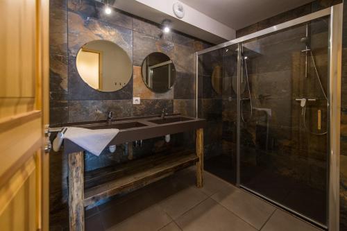 a bathroom with a sink and a shower at Chalet l'Alpette in La Toussuire