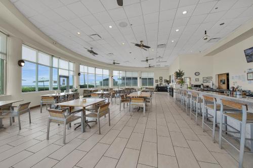 A restaurant or other place to eat at Peninsula Island Resort & Spa - Beachfront Property at South Padre Island