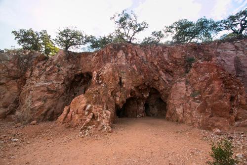 a cave in the side of a rocky mountain at Hotel Rio Tequisquiapan in Tequisquiapan