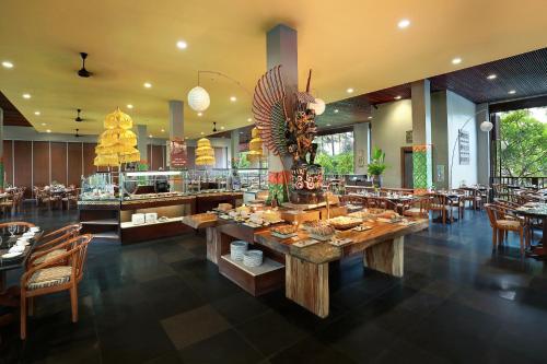 A restaurant or other place to eat at Legian Beach Hotel