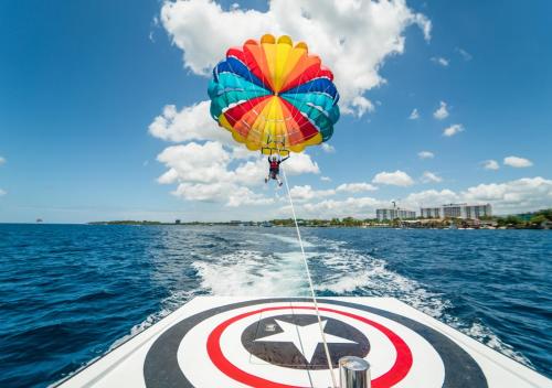 a colorful balloon is attached to the back of a boat at Jpark Island Resort & Waterpark Cebu in Mactan