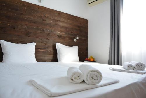 a bedroom with a bed with towels on it at Milennia Family Hotel in Sunny Beach
