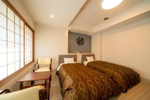 Una cama o camas en una habitación de Hotel Miya Rikyu