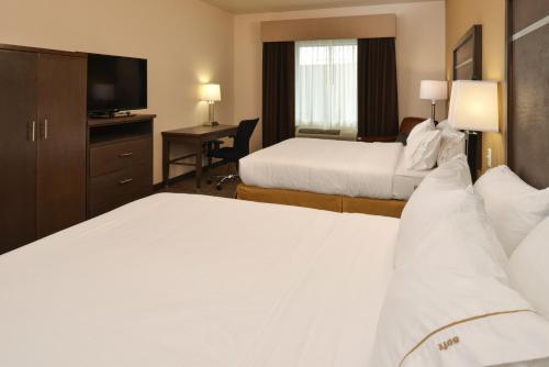 a hotel room with two beds and a television at Holiday Inn Express & Suites Globe by IHG in Globe