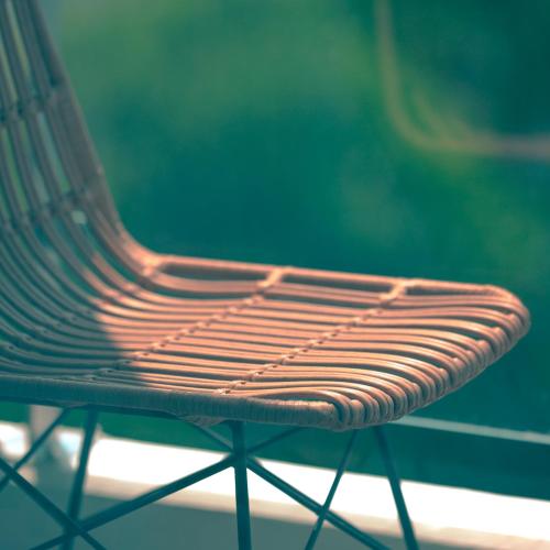 a wooden bench sitting in front of a window at Connect Busan Hotel & Residence in Busan