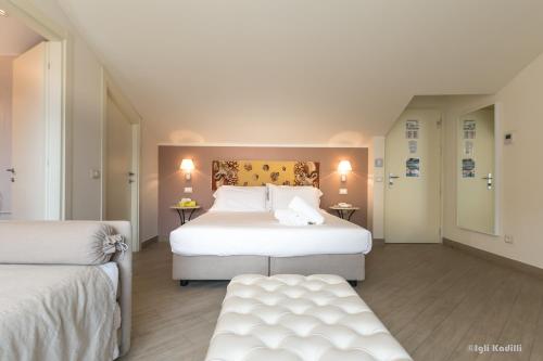 Postel nebo postele na pokoji v ubytování Hotel San Pietro Palace