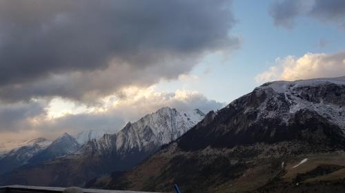 a view of a mountain range with snow covered mountains at Gîte Chalet du Soulor in Arrens-Marsous