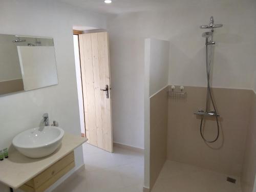 a bathroom with a sink and a shower at Garmen Hills Guest Houses in Garmen