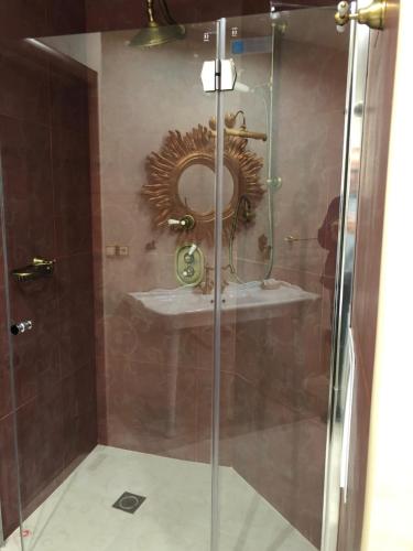 a bathroom with a sink and a mirror at Royal Nikita Apartments in Nikita