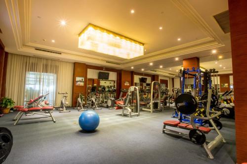 a gym with a bunch of equipment in a room at Landmark Mekong Riverside Hotel in Vientiane