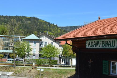 a building with a sign that reads alam brump at Wellness- und Bierhotel Adam Bräu in Bodenmais