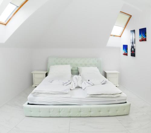 Posteľ alebo postele v izbe v ubytovaní Corso Lux Apartman