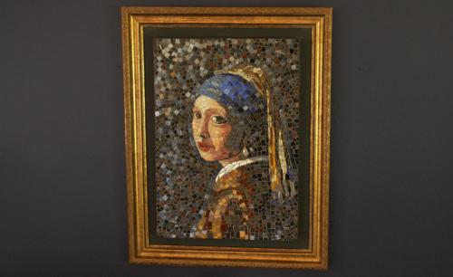 a painting of a woman in a blue hijab at The Gate Guesthouse in Clarens