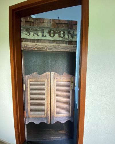 a wooden door with a window in a room at W.I.P. Welt im Park in Dresden
