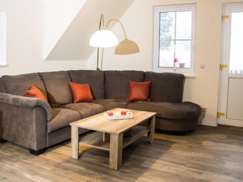 a living room with a couch and a coffee table at SALUS Spreewald - Erholung & Natur - in Kolonie