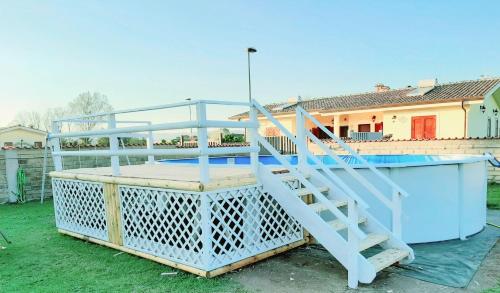 a white staircase on top of a house at Elegance B&B in Ladispoli