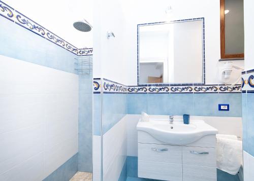 a bathroom with a sink and a mirror at O' Lattariello in Amalfi