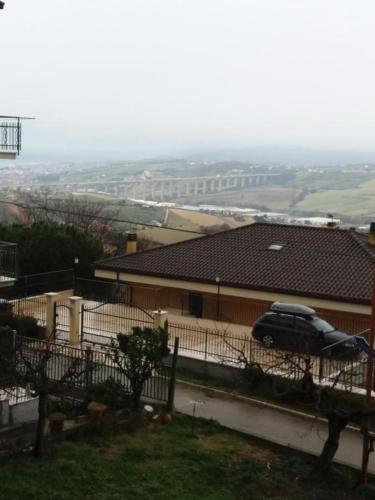 a car parked in a yard next to a house at Verde Mare 2 in Tortoreto Lido
