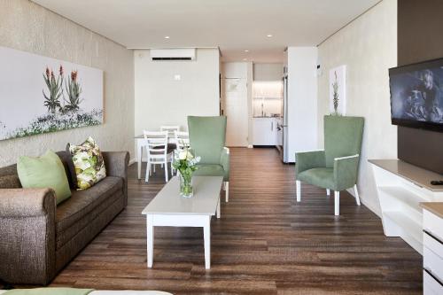 Ruang duduk di First Group Breakers Resort - Official