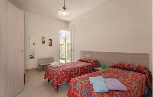 A bed or beds in a room at Villa Rosso Corallo