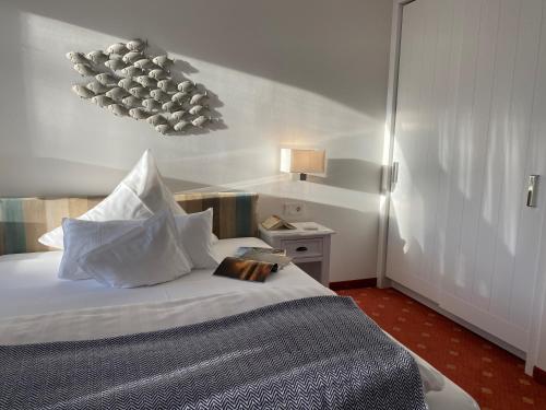 Postel nebo postele na pokoji v ubytování Hotel Wünschmann