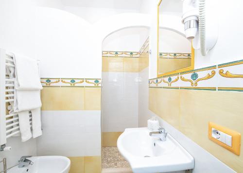 a bathroom with a sink and a mirror at O' Lattariello in Amalfi