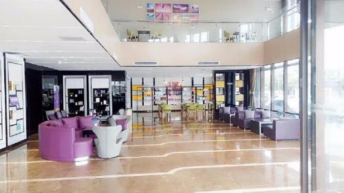 a store with purple chairs and tables in a building at Lavande Hotel Yinchuan Railway Station Wanda in Yinchuan