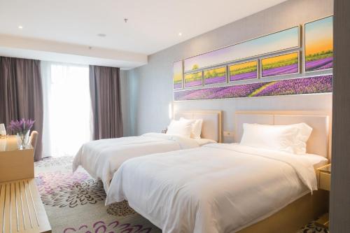 Posteľ alebo postele v izbe v ubytovaní Lavande Hotel Chongqing Yongchuan Leheledou Wanda